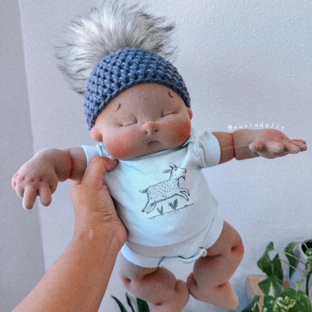 Adorable handmade soft sculpture baby doll with crochet Pom Pom hat